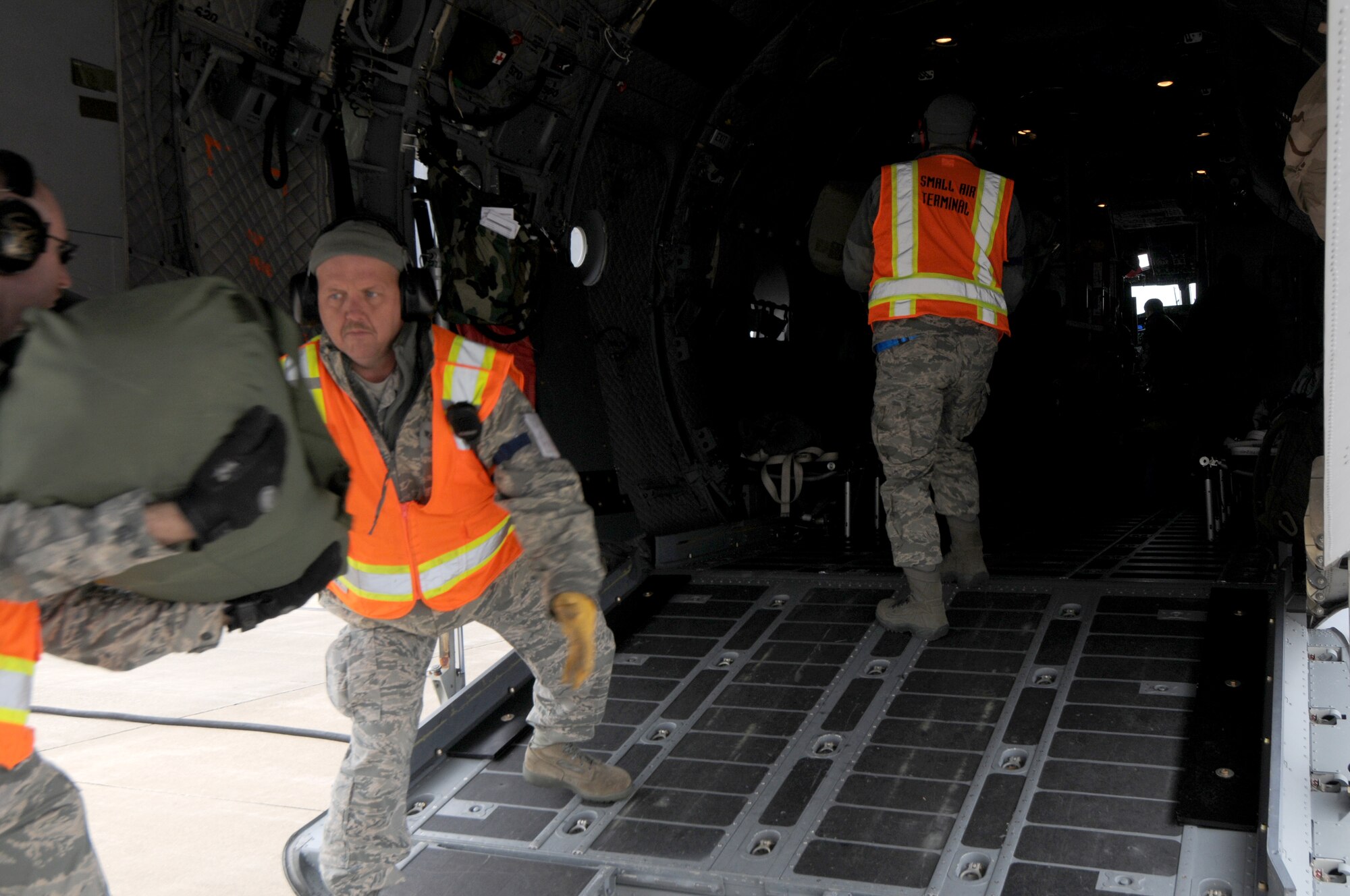 Members of the 110th Airlift Wing Aerial Port  load cargo and facilitate the departure of Army soldiers from the 351st Aviation Support Battalion, via C-27J aircraft on Saturday, March 31, 2012 at Battle Creek Air National Guard Base, Battle Creek, Mich. (U.S. Air National Guard photo by Master Sgt. Sonia Pawloksi /released)