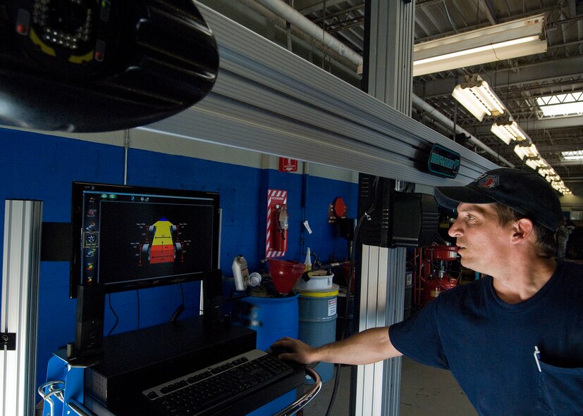 Bill Miley, Dyess Auto Hobby Shop technician, checks tire alignment with a Geoliner 680 May 1, 2012, at Dyess Air Force Base, Texas. The new $40,000 state-of-the-art machine allows auto shop technicians to complete tire alignments with pinpoint accuracy. Correct wheel alignments reduce tire wear, improves fuel efficiency, enhances the comfort of the ride and helps with safe steering. (U.S. Air Force photo by Airman 1st Class Damon Kasberg /Released)