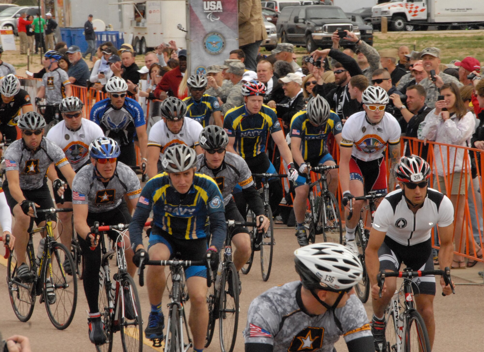 Sporting white jersey U.S. Special Operations Command team jerseys, members of the U.S. Air Force Special Operations and U.S. Army Special Operations community compete in the men's 30 kilometer open bicycle competition during the 2012 Warrior Games in Colorado Springs, Colo., May 1. The annual event provides wounded, ill or injured service members from every military branch the opportunity to compete in seven athletic competitions during the week-long events. 