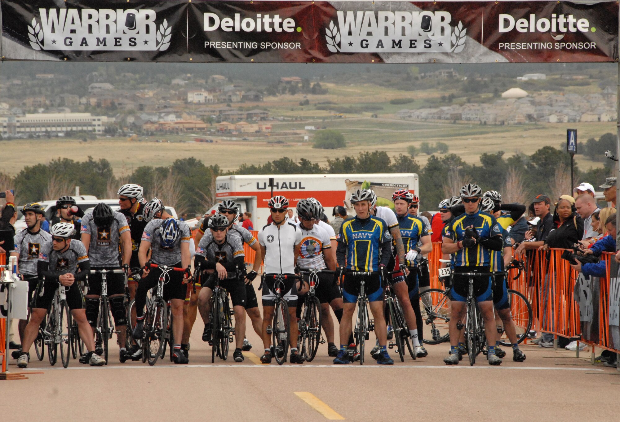 Wounded service members past and present gather at the cycling starting line to compete in the men's 30 kilometer open bicycle competition at the 2012 Warrior Games in Colorado Springs, Colo., May 1.
