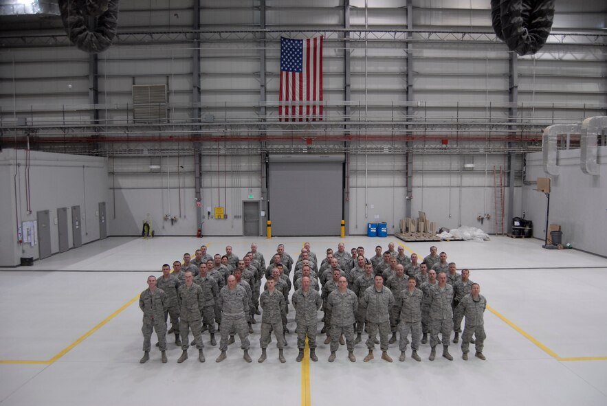 C-130 maintenance crews from the 133rd Airlift Wing, currently deployed to Bagram Airfield in Afghanistan, pause for a group photo on March 23, 2012 in a hangar. They have been deployed from the Minnesota Air National Guard since early March and are responsible for keeping the 455th Air Expeditionary Wing’s “Hercules” military cargo aircraft flying in support of Operation Enduring Freedom. USAF official photo by Staff Sgt. Anthony Ressie (released)