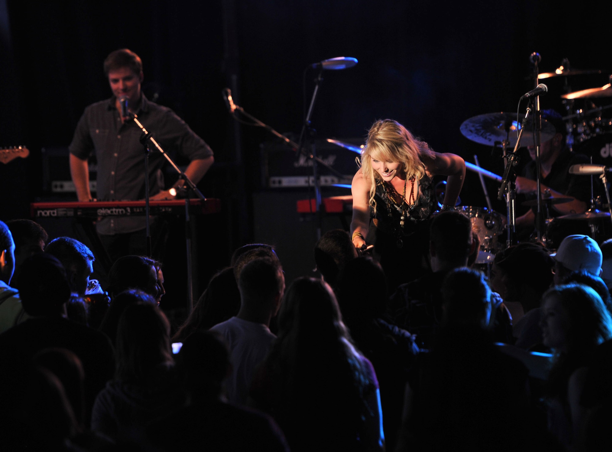 RAF MILDENHALL, England – Country singer Nicole Frechette, interacts with the audience during a concert at the Northside Fitness Center here May 1, 2012. Frechette and the band, Taking Back Sunday, have performed for troops on several military installations in Italy, Spain and Germany. (U.S. Air Force photo/Senior Airman Jerilyn Quintanilla)
