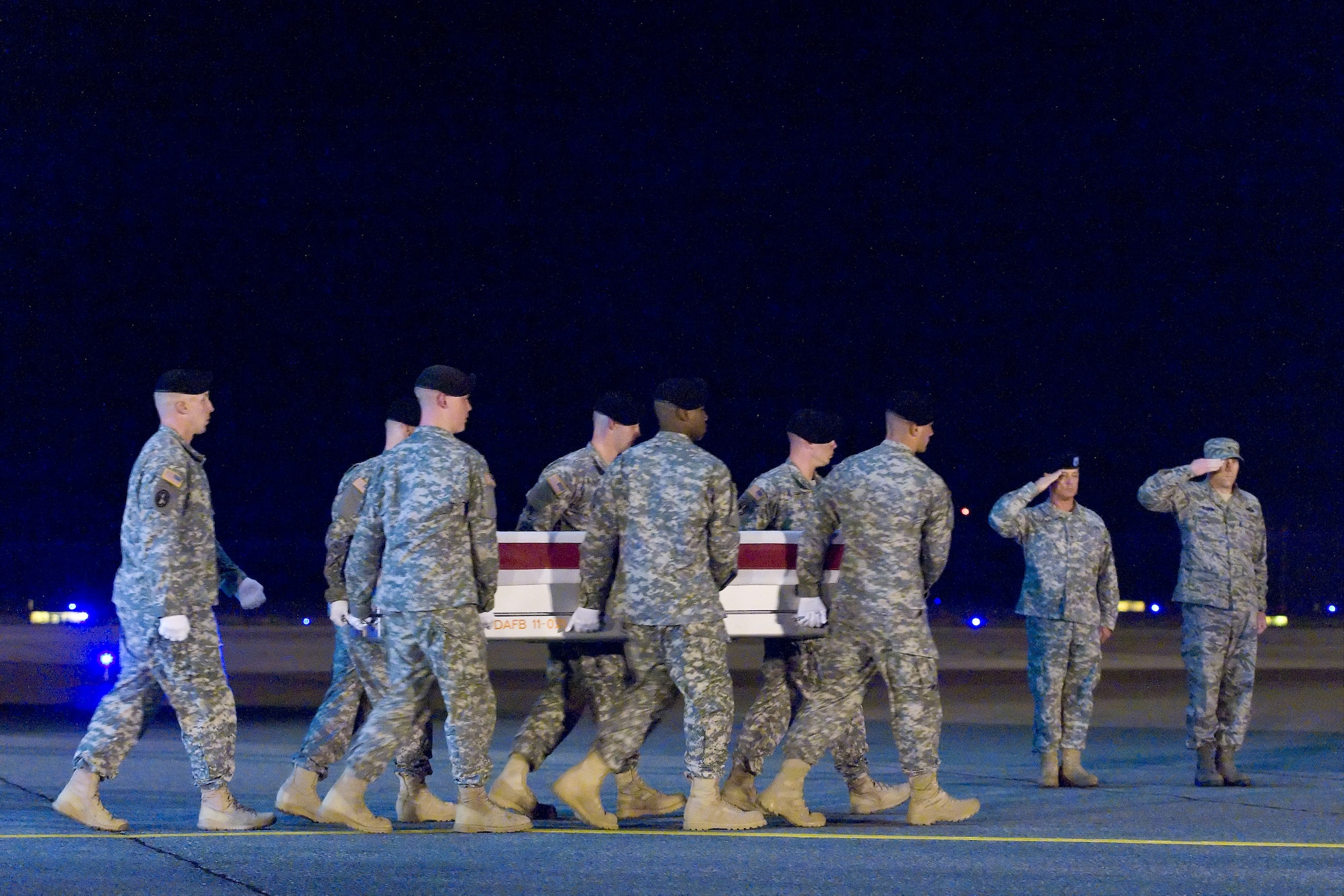 A U.S. Army carry team transfers the remains of Army Sgt. Nicholas M. Dickhut, of Rochester, Minn., at Dover Air Force Base, Del., May 2, 2012. Dickhut was assigned to the 5th Battalion, 20th Infantry Regiment, 3rd Stryker Brigade Combat Team, 2nd Infantry Division, Joint Base Lewis-McChord, Wash. (U.S. Air Force photo/Roland Balik)
