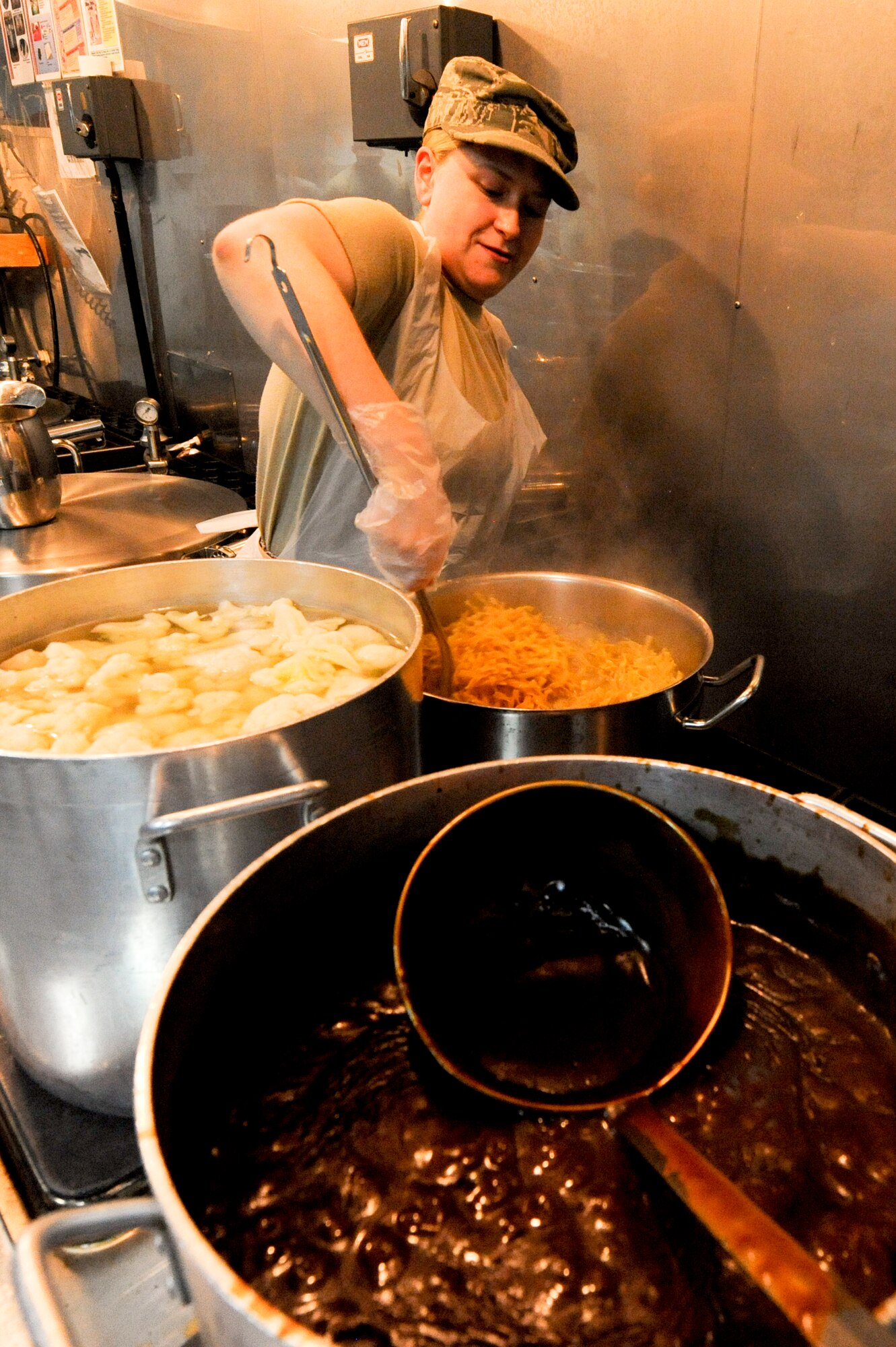SOUTHWEST ASIA -- Senior Airman Jennifer Frost, 332nd Expeditionary Force Support Squadron, prepares vegetables for the lunch meal here, May 1, 2012. Frost is deployed from Minot Air Force Base, N.D., and is a native of Kalamazoo, Mich. (U.S. Air Force photo by Staff Sgt. Joshua J. Garcia)