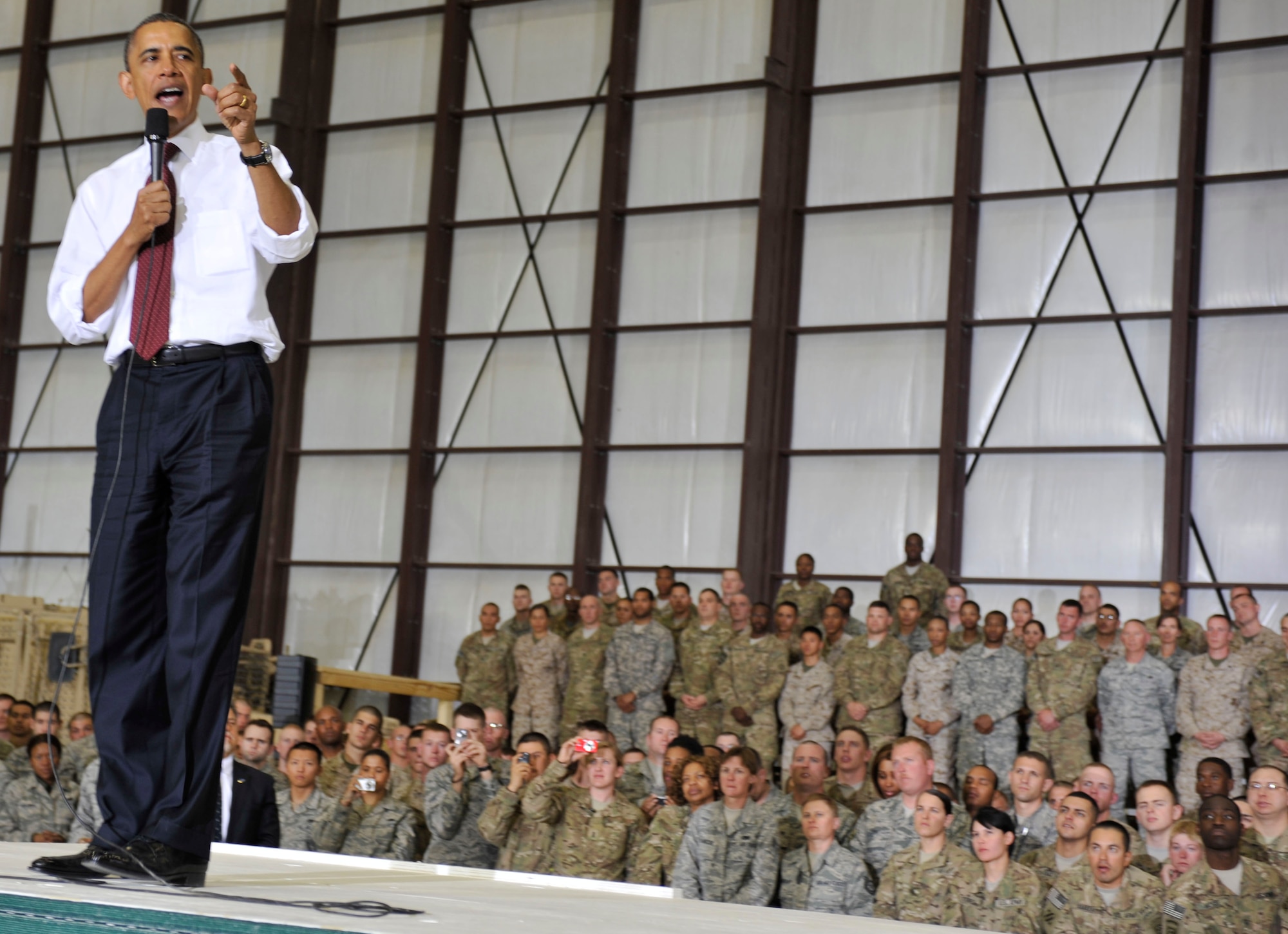 United States President Barack Obama visited Bagram Airfield, Afghanistan to greet Soldiers, Sailors, Airmen and Marines on the anniversary of the death of Al Qaeda leader, Osama Bin Laden.  President Obama told the crowd that he is proud of them and that many of the positive events in Afghanistan occurred in part because of all the U.S. armed services have done.  The event was held in the 455th Air Refueling Wing’s C-130 hangar on May 2, 2012.  (U.S. Air Force photo/Airman 1st Class Ericka Engblom)