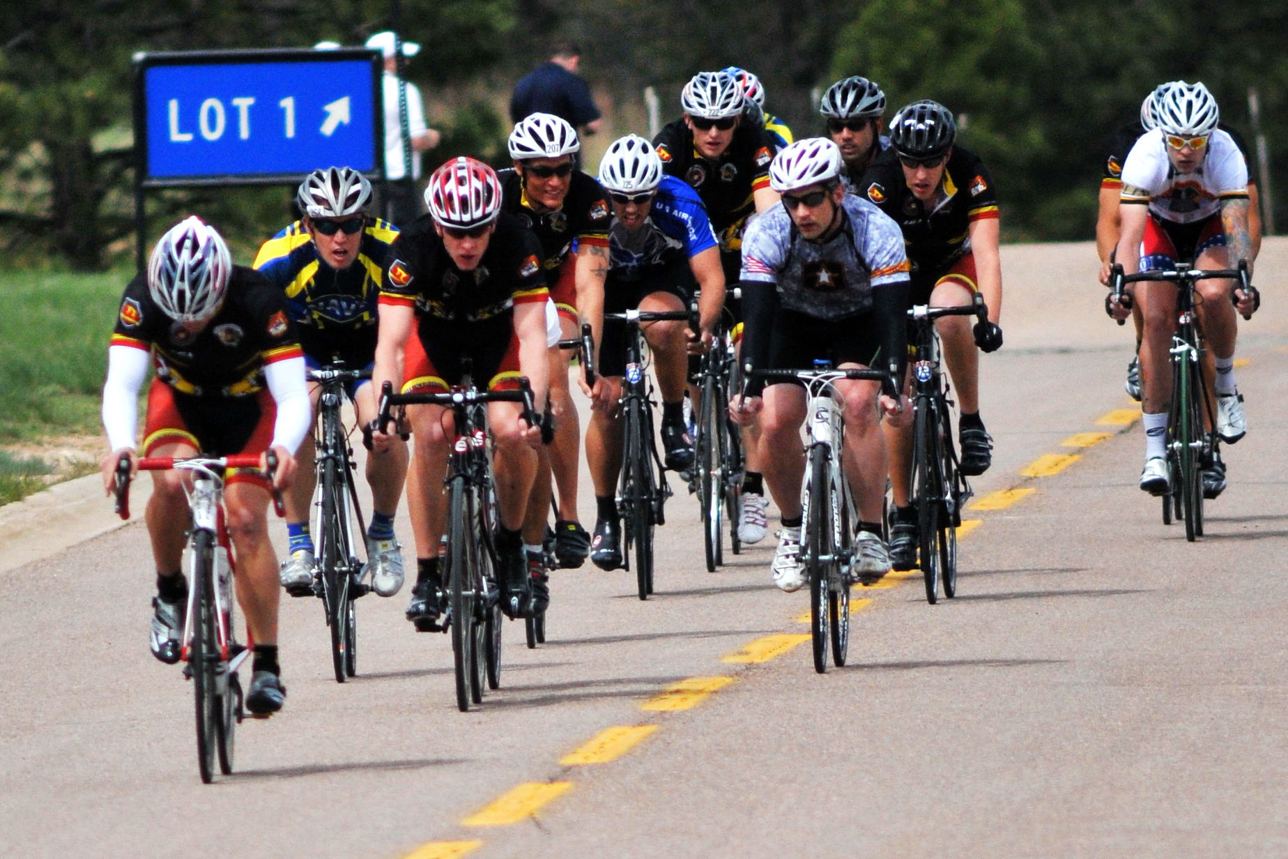 Racers jockey for position at the first turn in the men s bicycle