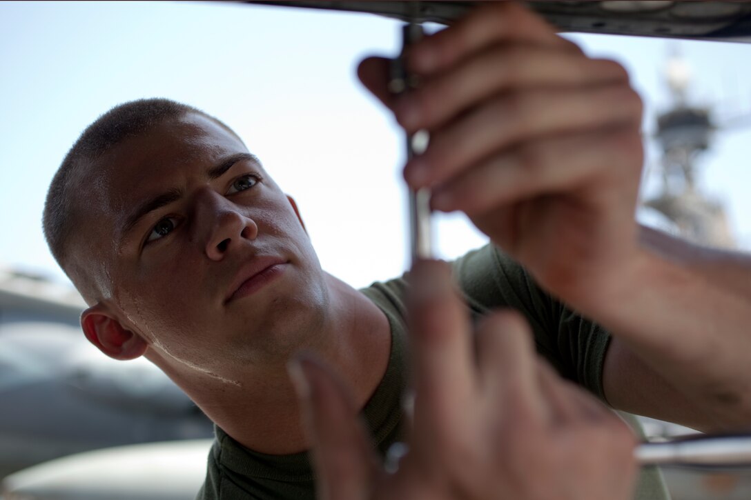 Cpl. Adam L. Morrell loads flares onto an AV-8B Harrier aboard USS Makin Island here May 2. The 20-year-old Westminster, Md., native serves as an aviation ordnance technician with Marine Medium Helicopter Squadron 268 (Reinforced), the aviation combat element for the 11th Marine Expeditionary Unit. The unit is deployed as part of the Makin Island Amphibious Ready Group, currently a U.S. Central Command theater reserve force. The group is providing support for maritime security operations and theater security cooperation efforts in the U.S. Navy's 5th Fleet area of responsibility.