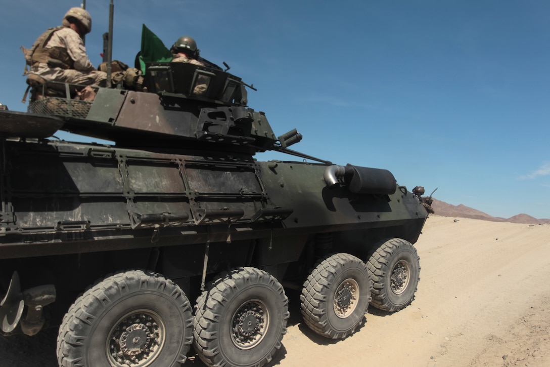 Marines with 3rd Light Armored Reconnaissance Battalion prepare to fire during the defensive engagement portion of their Table 6 gunner qualification May 3, 2012, at Range 500. (Official USMC photo by Lance Cpl. Ali Azimi)