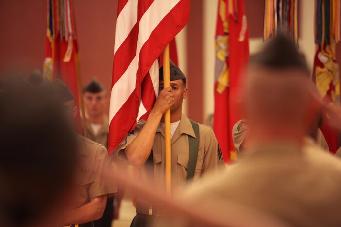 Sgt. Calvin D. Williams Jr., the color sergeant for 2nd Marine Logistics Group, holds the American flag during a post and relief ceremony aboard Camp Lejeune, N.C., May 3, 2012.  Williams, a Macon, Ga., native, was recently appointed the color sergeant for 2nd MLG after a week-long selection process led by the command sergeant major and the outgoing color sergeant. (Photo by Cpl. Bruno J. Bego)