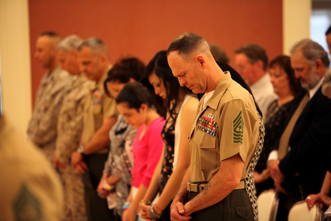Sgt. Maj. William T. Stables, the outgoing sergeant major for 2nd Marine Logistics Group, bows his head during an invocation as part of his appointment and relief ceremony aboard Camp Lejeune, N.C., May 3, 2012.  Stables relinquished his post to Sgt. Maj. George W. Young