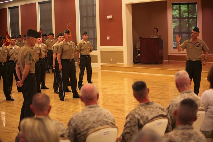 Maj. Gen. Michael G. Dana (right), the 2nd Marine Logistics Group commanding general, speaks to the audience about Sgt. Maj. William T. Stables (left), the outgoing group sergeant major, during an appointment and relief ceremony aboard Camp Lejeune, N.C., May 3, 2012.  During the ceremony, Stables relinquished his post to Sgt. Maj. George W. Young Jr.