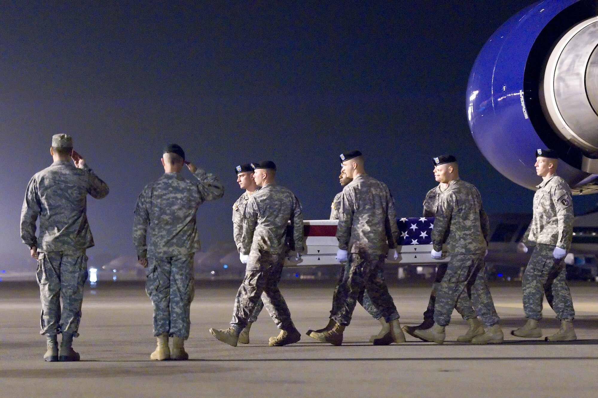A U.S. Army carry team transfers the remains of Army Capt. Bruce K. Clark, of Spencerport, N.Y., at Dover Air Force Base, Del., May 3, 2012. Clark was assigned to A Company, Troop Command, William Beaumont Army Medical Center, El Paso, Texas. (U.S. Air Force photo/Roland Balik)