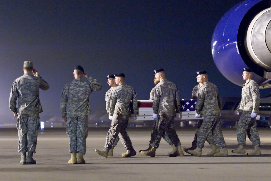 A U.S. Army carry team transfers the remains of Army Capt. Bruce K. Clark, of Spencerport, N.Y., at Dover Air Force Base, Del., May 3, 2012. Clark was assigned to A Company, Troop Command, William Beaumont Army Medical Center, El Paso, Texas. (U.S. Air Force photo/Roland Balik)
