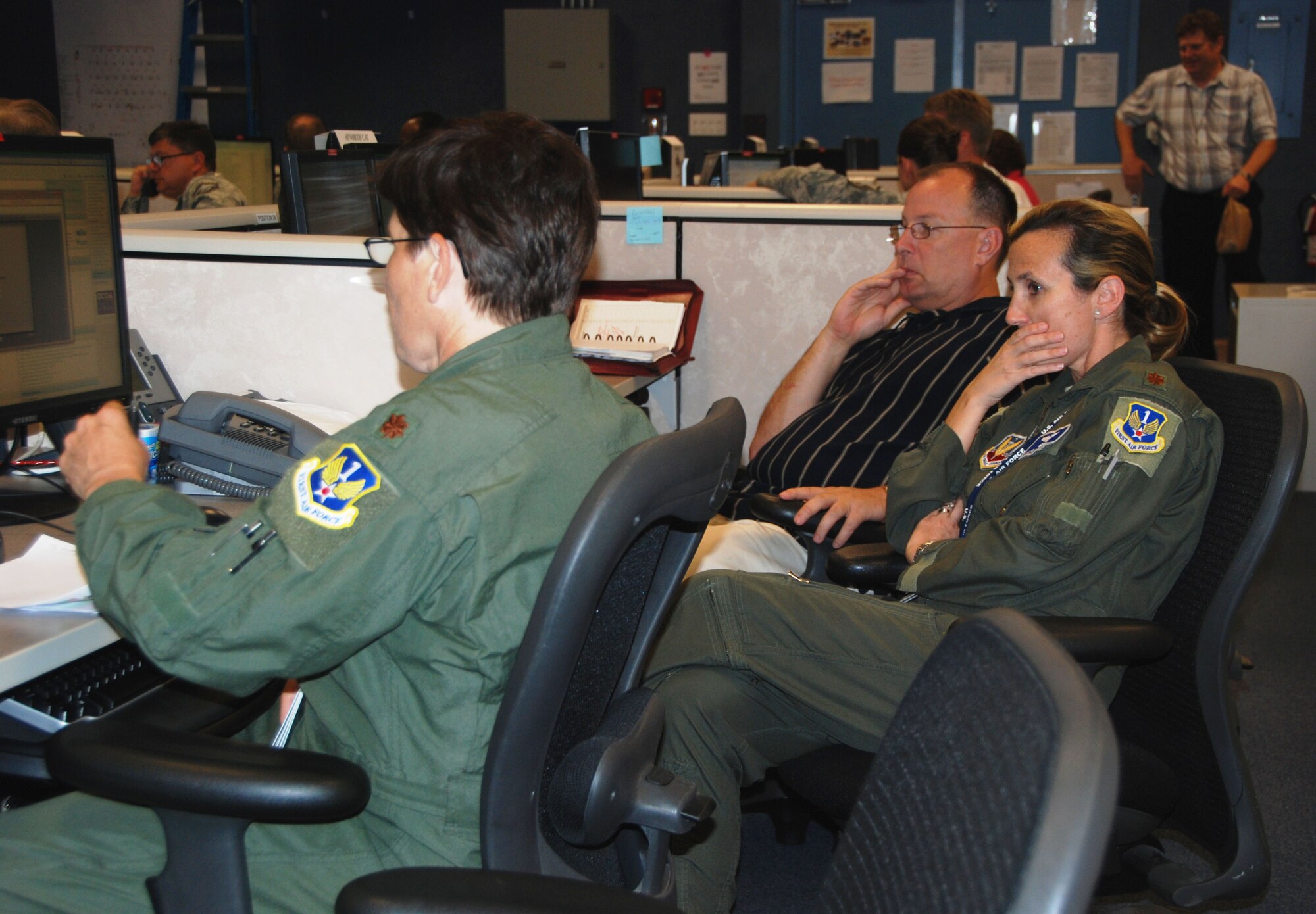 Air Forces Northern Current Operations Cell members Maj Dawn Junk, Maj Lori Rasmussen, and Mr Mark Lilly monitor exercise Hurricane Zelda development and anticipate what support civilian authorities may need during Ardent Sentry ‘12.  Exercise Ardent Sentry ’12, conducted by U.S. Northern Command (USNORTHCOM), is designed to validate existing plans, policies, and procedures, including the Federal Inter-agency Response Plans, for Defense Support of Civil Authorities response.