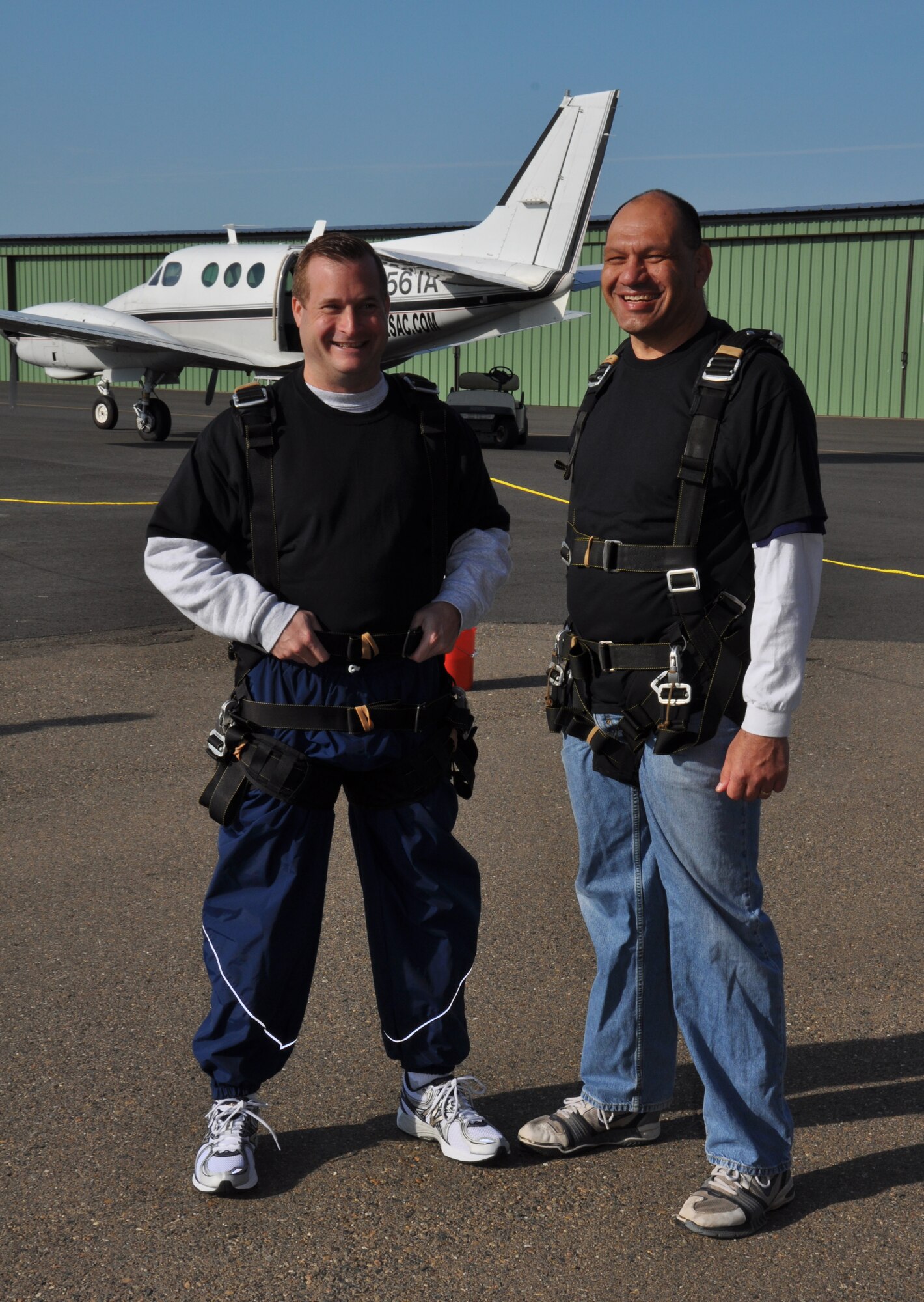 Col. Phil Stewart, 9th Reconnaissance Wing vice commander, and Chief Master Sgt. Robert White, 9 RW command chief, get ready for their Jump Into Prevention skydive at Lincoln Regional Airport, Calif., April 27, 2012. More than 70 Beale Airmen participated in the sexual assault awareness event.