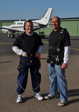 Col. Phil Stewart, 9th Reconnaissance Wing vice commander, and Chief Master Sgt. Robert White, 9 RW command chief, get ready for their Jump Into Prevention skydive at Lincoln Regional Airport, Calif., April 27, 2012. More than 70 Beale Airmen participated in the sexual assault awareness event.