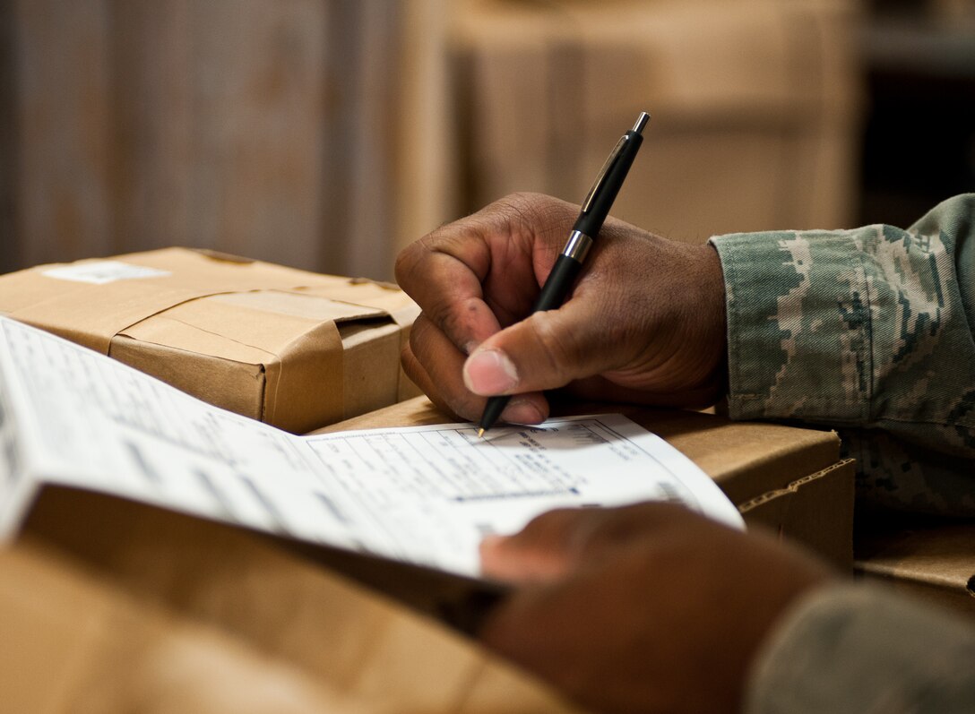 Airman 1st Class Derek Barbour, 28th Logistics Readiness Squadron packing and crating technician, verifies shipping contents being delivered at Ellsworth Air Force Base, S.D., May 1, 2012. The 28th LRS packing and crating section ships all aircraft and supply parts. (U.S. Air Force photo by Airman 1st Class Alystria Maurer/Released)