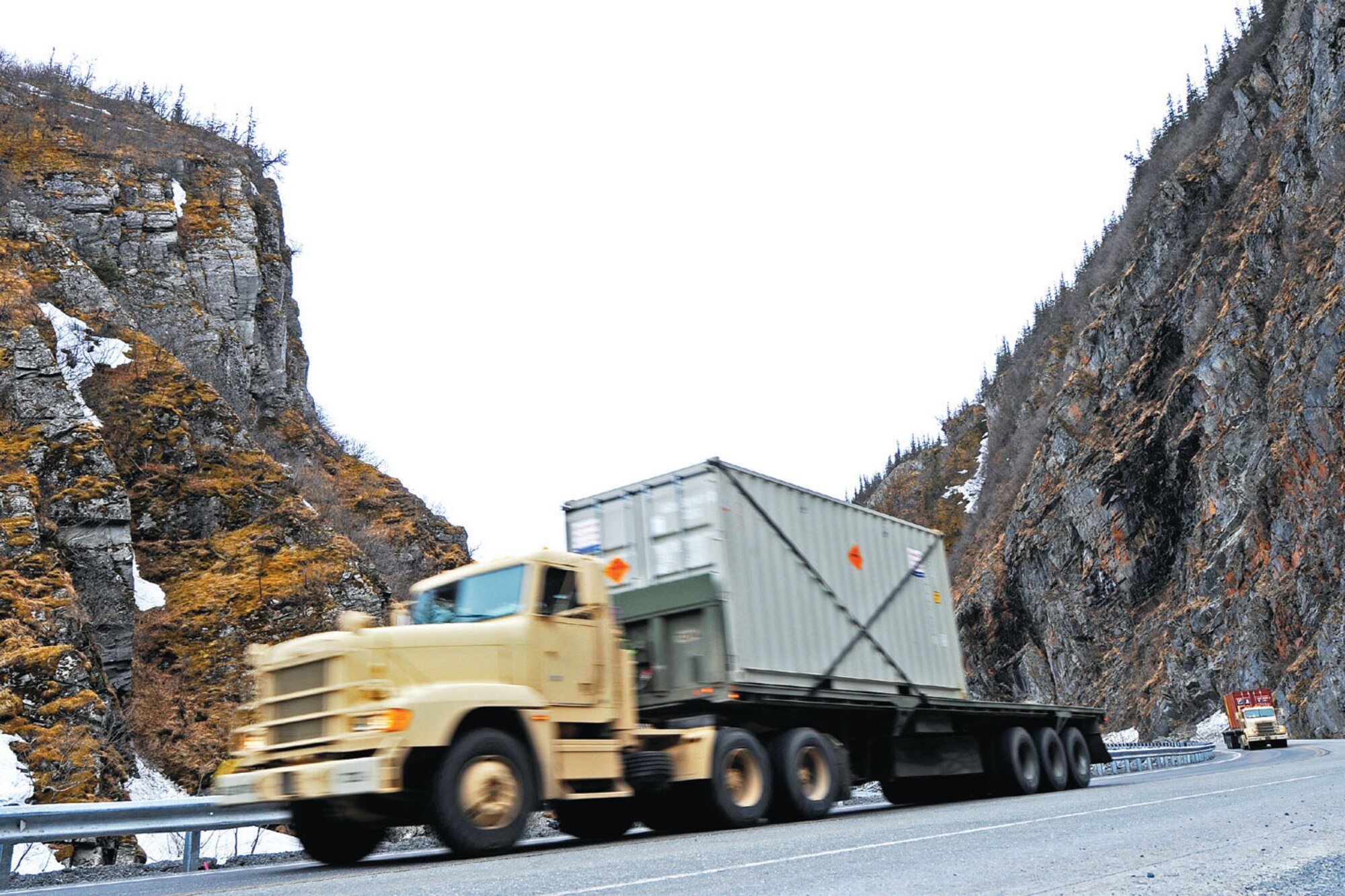 Soldiers from the 109th Transportation Company transport ammunition containers through Thompson Pass on their way to Fort Wainwright April 29. (U.S. Air Force photo/Tech. Sgt. Brian Ferguson)