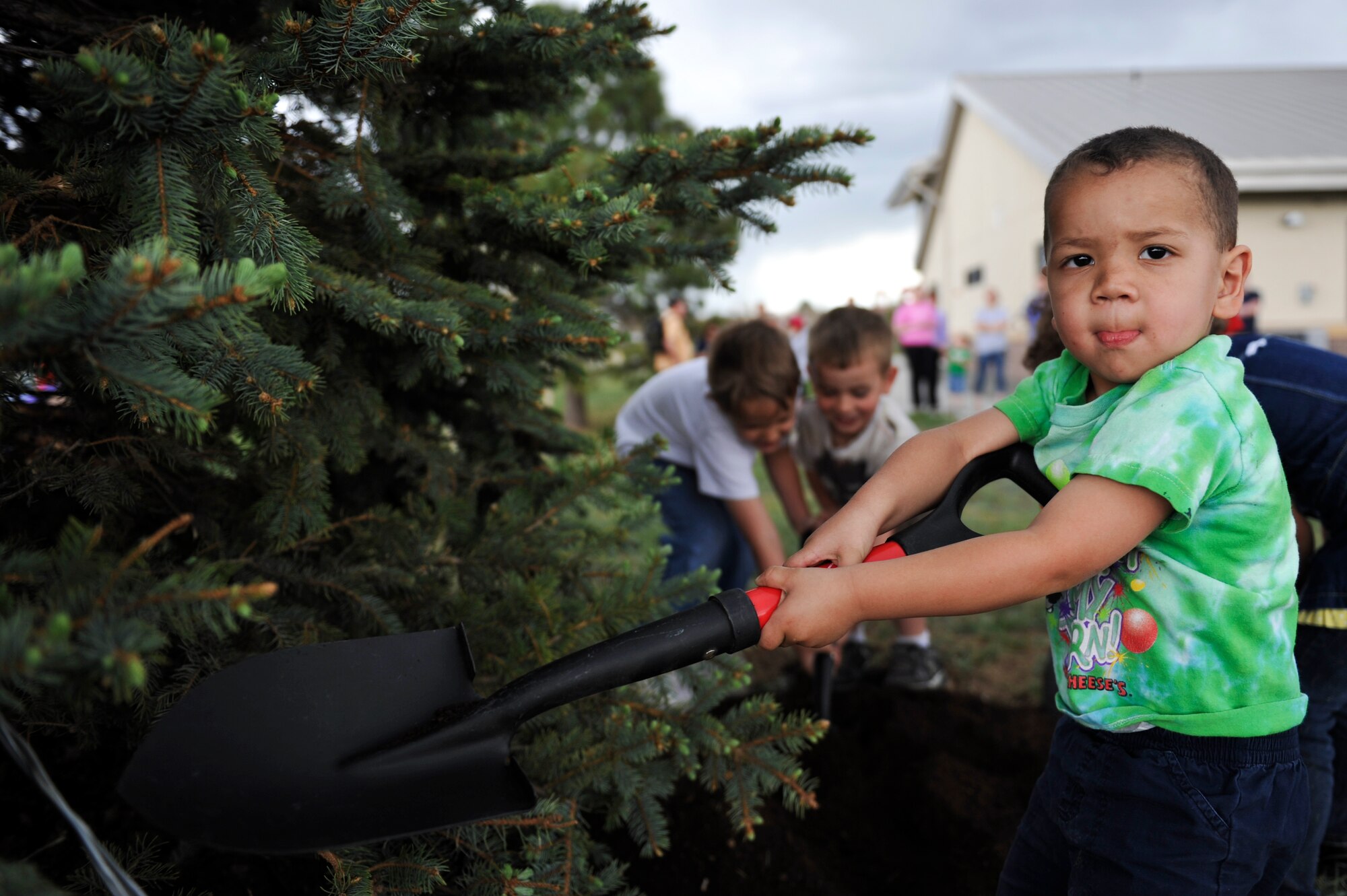 BUCKLEY AIR FORCE BASE, Colo. – Thomas Tegtman, from the Buckley Child Development Center, plants a tree for Buckley’s Arbor Day Celebration, April 26, 2012. These children contributed to helping Buckley’s environment and were taught the meaning of Arbor Day. (U.S. Air Force photo by Airman 1st Class Darryl Bolden Jr.)