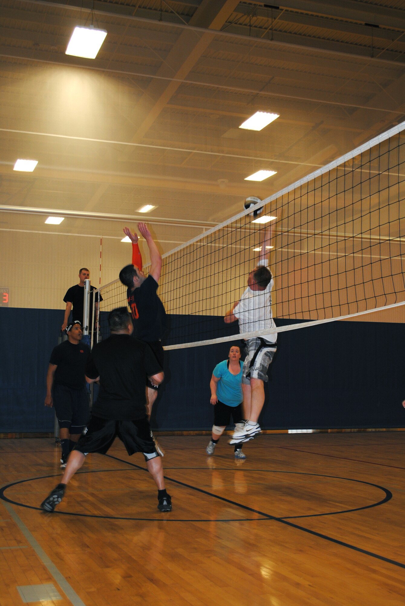 During a volleyball match in the round robin portion of Malmstrom's tournament, two teams play each other with the hopes of landing one of six spots in the afternoon competition. (U.S. Air Force photo/Airman 1st Class Cortney Paxton)