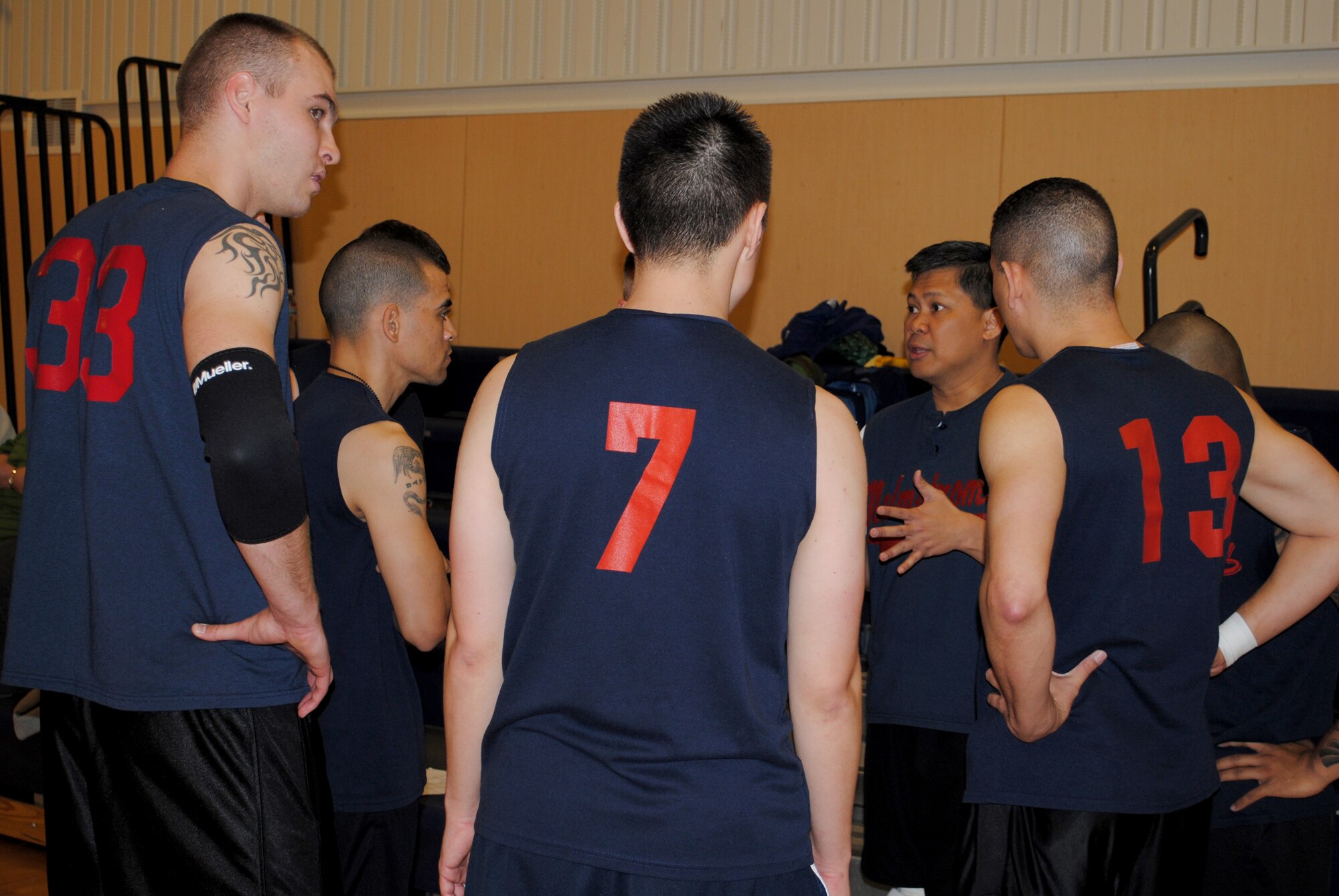 Following a game, Col. H.B. Brual, 341st Missile Wing commander, speaks to the members on his team about their strengths and weaknesses. (U.S. Air Force photo/Cortney Paxton)
