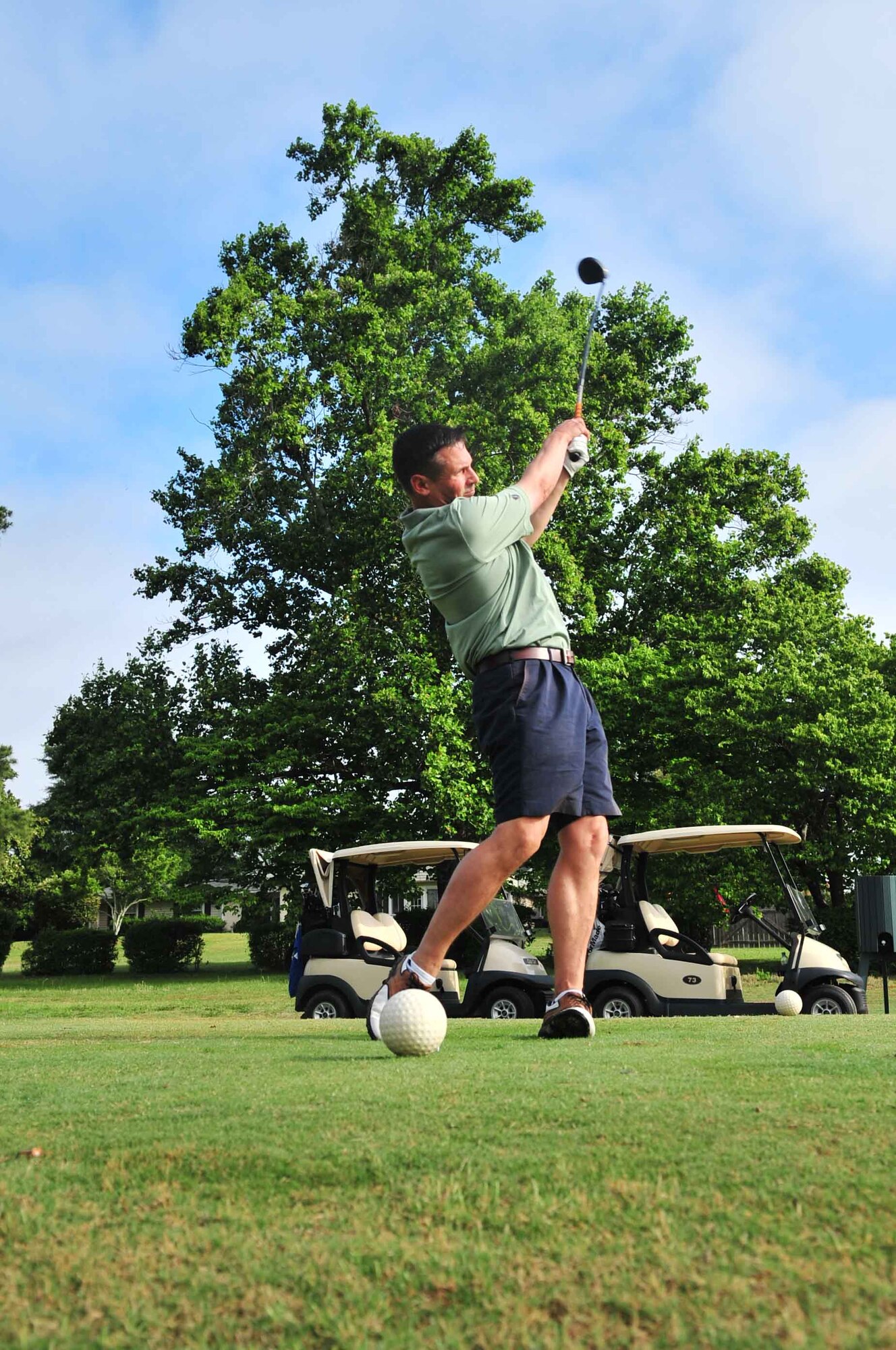 U.S. Air Force Col. Clay Hall, 20th Fighter Wing commander, tees off during the Thunder over the Midlands golf tournament at Carolina Lakes, Shaw Air Force Base, S.C., May 3, 2012. There were 22 teams that participated in the early morning event, which signified the start of the Shaw Air Expo, which will be open May 5 and 6. (U.S. Air Force photo by Airman 1st Class Ashley L. Gardner/ Released)
