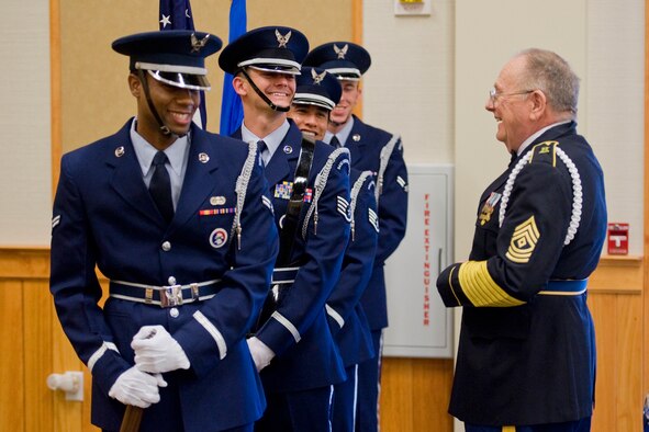 Retired U.S. Army Sgt. 1st Class Ron Sperandeo shares a lighthearted moment with the Honor Guard as they wait for the festivities to get under way at the Grizzly Bend. (U.S. Air Force photo/Beau Wade)