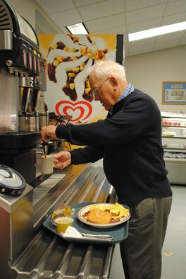 Retiree Ed Hanson fills up on a morning brunch at the Elkhorn Dining Facility. (U.S. Air Force photo/Airman 1st Class Katrina Heikkinen)