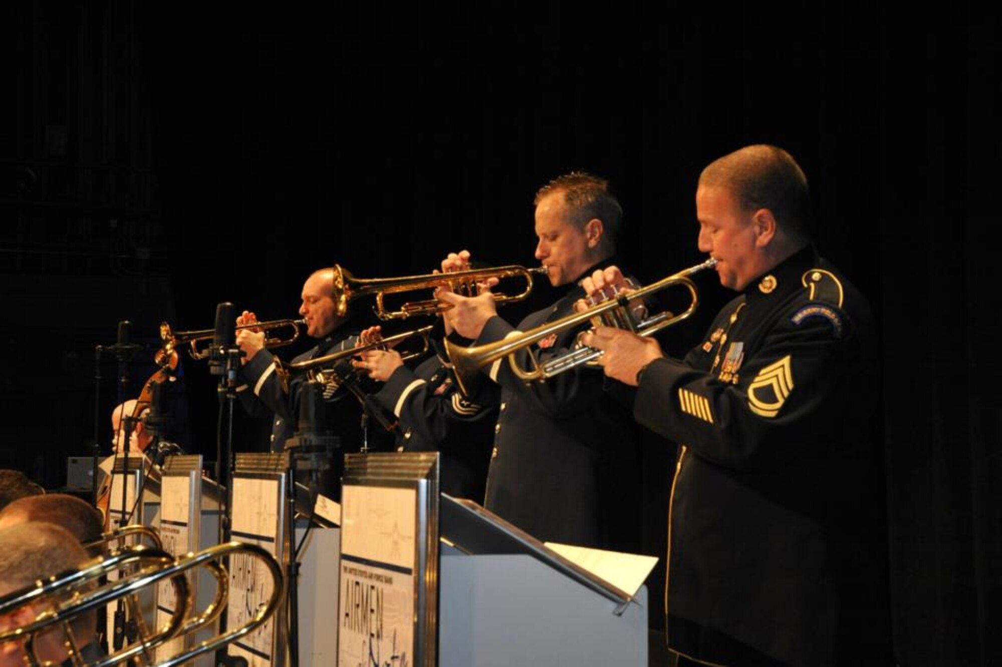 The Airmen of Note perform before a packed house April 26 at the Coastal Carolina University Wheelwright Auditorium in Conway, S.C. The trumpeters of "The Note," from left to right, are Master Sgt. Rich Sigler, Master Sgt. Brian MacDonald, Senior Master Sgt. Kevin Burns, and guest trumpeter Army Sgt 1st Class Paul Armstrong. (U.S. Air Force photo/Kristal Gault)
