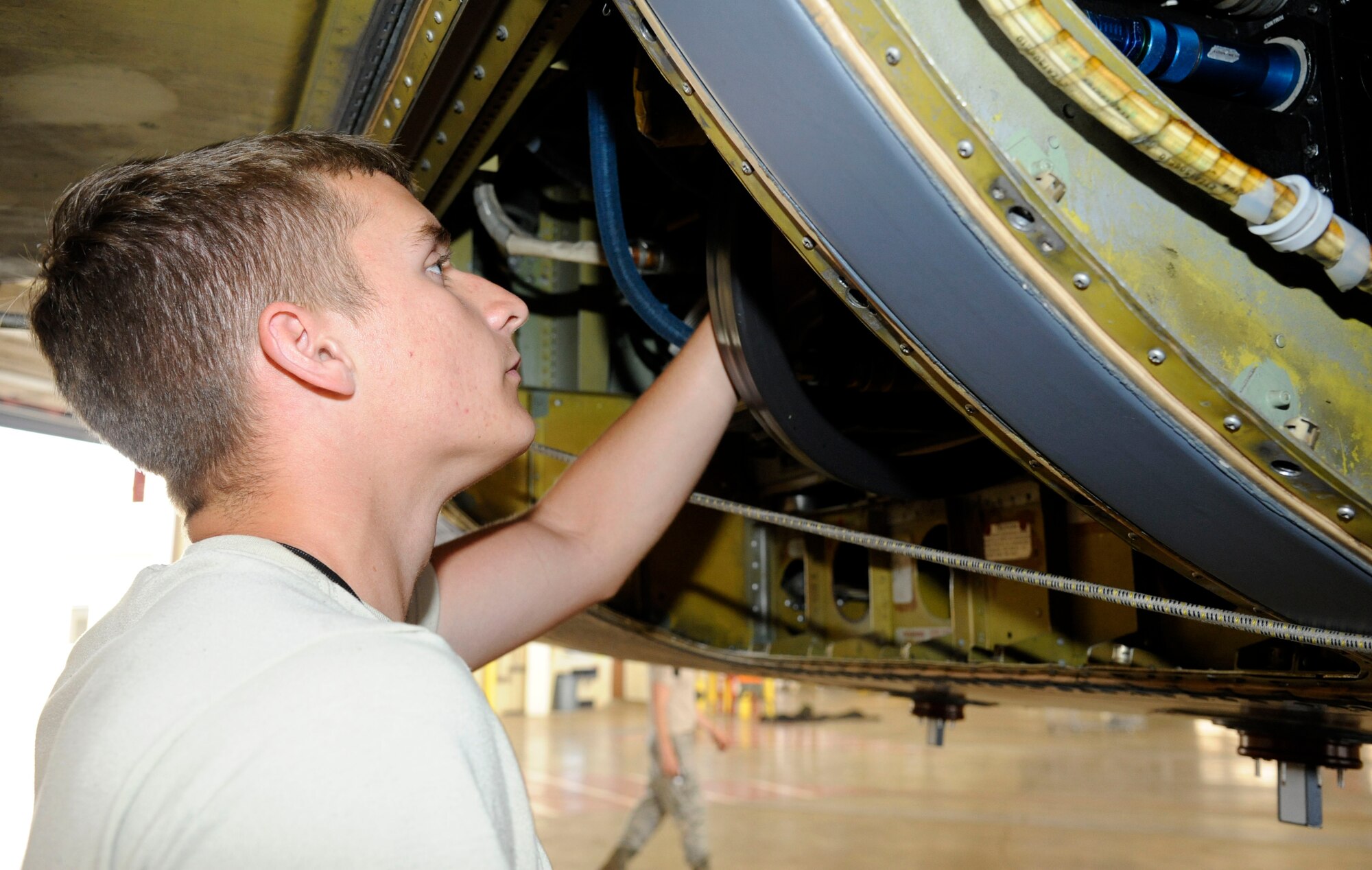 Senior Airman Hinz Bartnick, 2nd Maintenance Squadron, inspects the line replaceable units on a B-52H Stratofortress inside the Phase Hangar on Barksdale Air Force Base, La., May 1. The LRUs "talk" to each other to make sure the aircraft displays availability of electronic countermeasures to the aircrew. (U.S. Air Force photo/Airman 1st Class Andrew Moua)(RELEASED)