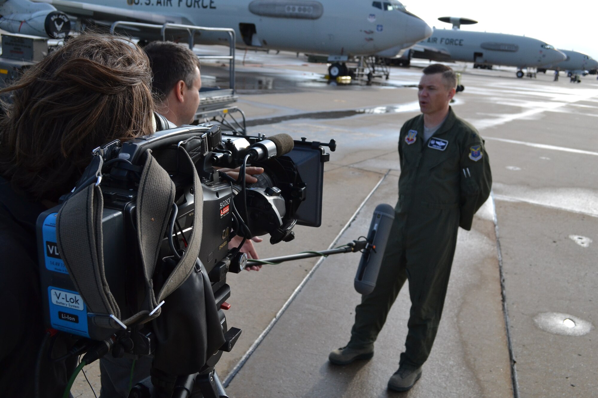 Jack Burton and Nick Chapman, from left, a film crew with the Discovery Channel, interview 552nd Air Control Wing Commander Col. John T. Rauch in the “Bird Cage” on April 30, prior to flying a sortie in the E-3 “Sentry” Airborne Warning and Control Systems aircraft. The Discovery crew was at Tinker Air Force Base filming a documentary on the E-3 as part of the network’s ongoing “Military Top Ten” series. The show is expected to air in late August or early September. (Air Force photo by Darren D. Heusel)