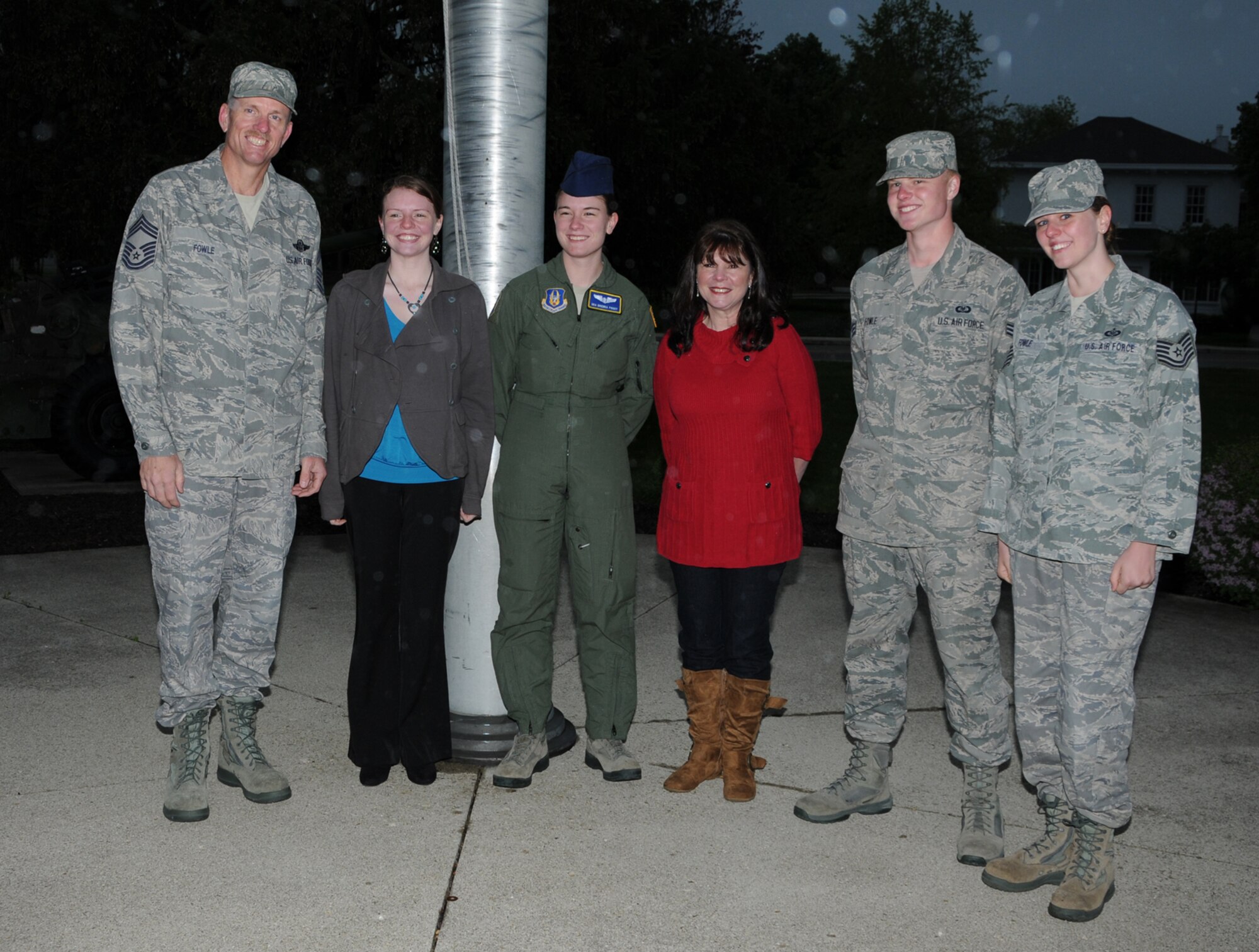 WRIGHT-PATTERSON AIR FORCE BASE, Ohio – Airman 1st Class Bethany Fowle, 445th Aircraft Maintenance Squadron, reenlisted in the Air Force Reserve April 21 after serving on active duty for 2 1/2 years. Her family celebrates her reenlistment. From left to right; Chief Master Sgt. Brian Fowle, 445th Aeromedical Evacuation Squadron; Bethany; Senior Airman Brenna Fowle, 445th AES; Senior Master Sgt. (ret.) Melissa Fowle; Senior Airman Brantley Fowle, 445th Operations Support Squadron; and Tech. Sgt. Brianne Fowle, 445th AES. (U.S. Air Force photo/Tech. Sgt. Anthony Springer)