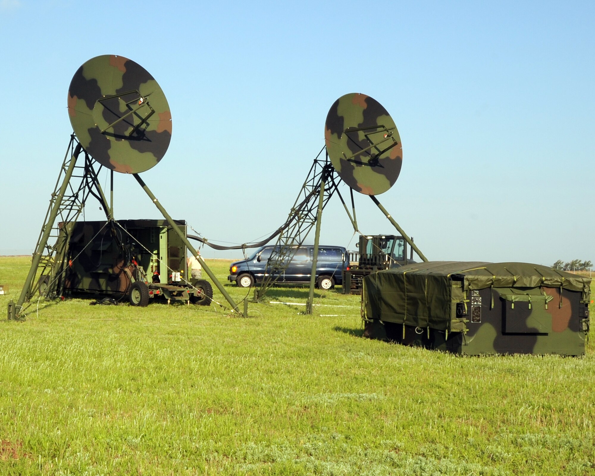 ALTUS AIR FORCE BASE, Okla. - A Tropospheric Scatter Microwave Radio Terminal (TRC-170) from the 31st Combat Communication Squadron, Tinker Air Force Base, Okla., is positioned in a field during an exercise at Altus AFB May 1, 2012. During the exercise Airmen from the 31st and 34th CCS assembled two TRC-170s, which transmitted a signal to Tinker AFB to test the range of the system. The exercise took place April 30 through May 4. (U.S. Air Force photo by Airman 1st Class Kenneth W. Norman / Released / 97th Air Mobility Wing Public Affairs)