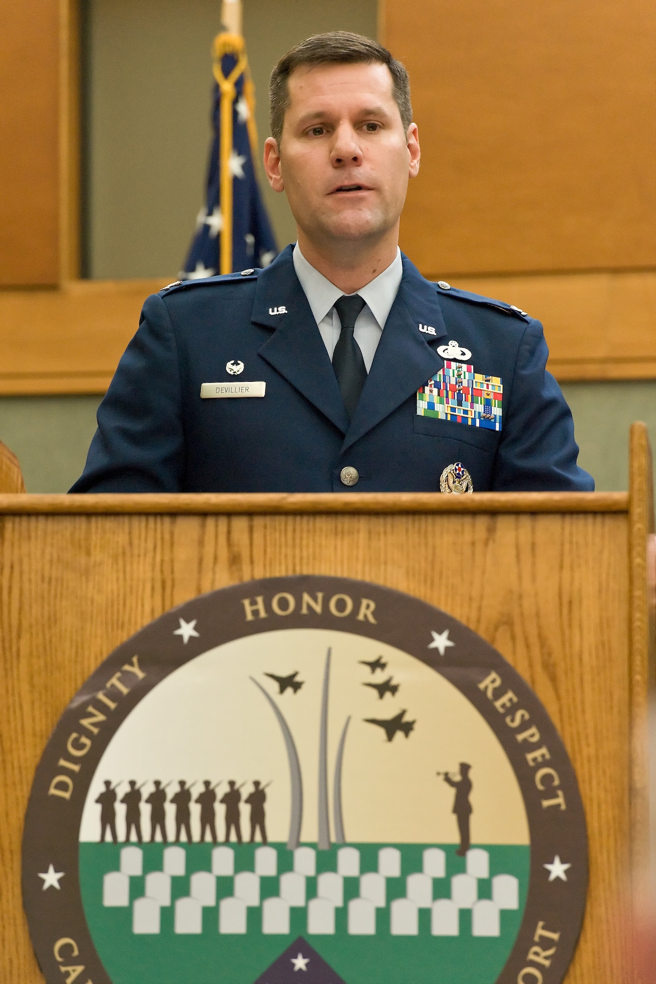 Col. John Devillier speaks to the audience after he assumed command of Air Force Mortuary Affairs Operations May 2, 2012 at Dover Air Force Base, Del. Devillier said he was honored to be the new commander and thanked the men and women for what they do for fallen heroes. (U.S. Air Force photo/Roland Balik)