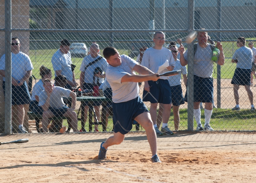 23d Maintenance Group Airmen play baseball during Sports Day at Moody Air Force Base, Ga., April 27, 2012. Sports day began with a formation run followed by a pig roast, music throughout the day from a disc jockey, and ended with the presentation of a trophy given to the unit that gained the most points from the events. (U.S. Air Force photo by Senior Airman Eileen Meier/Released)