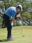 Scott Wieters, Scott & White Hospital trauma emergency docotor, chips his ball onto the 9th green at Randolph Oaks Golf Course April 19. The golf tournament was a  Joint Base San Antonio Earth Day celebration. (U.S. Air Force photo by Benjamin Faske)