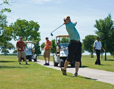 Ben Martinez, 902nd Civil Engineer Squadron asset management specialist, hits his aproach shot from the rough at Randolph Oaks Golf Course April 19. The golf tournament was a Joint Base San Antonio-Randolph Earth Day celebration. (U.S. Air Force photo by Benjamin Faske)