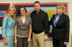 Second Lady of the United States Dr. Jill Biden (left), and U.S. Navy Adm. James “Sandy” Winnefeld, Jr. (right-center), Vice Chairman of the Joint Chiefs of Staff, join Kristina Gomez (left-center), Fort Eustis' School Liaison, during a visit to Lee Hall Elementary School in Newport News, Va., April 25, 2012. Biden and Winnefeld visited the school to celebrate an anniversary event highlighting the importance of helping military-connected children in schools. The visit detailed nearby Old Dominion University's Teaching, Education and Awareness for Military-Connected, or TEAMS, initiative to demonstrate how higher education institutions can work alongside local schools to meet the needs of children of military families. (Courtesy photo)