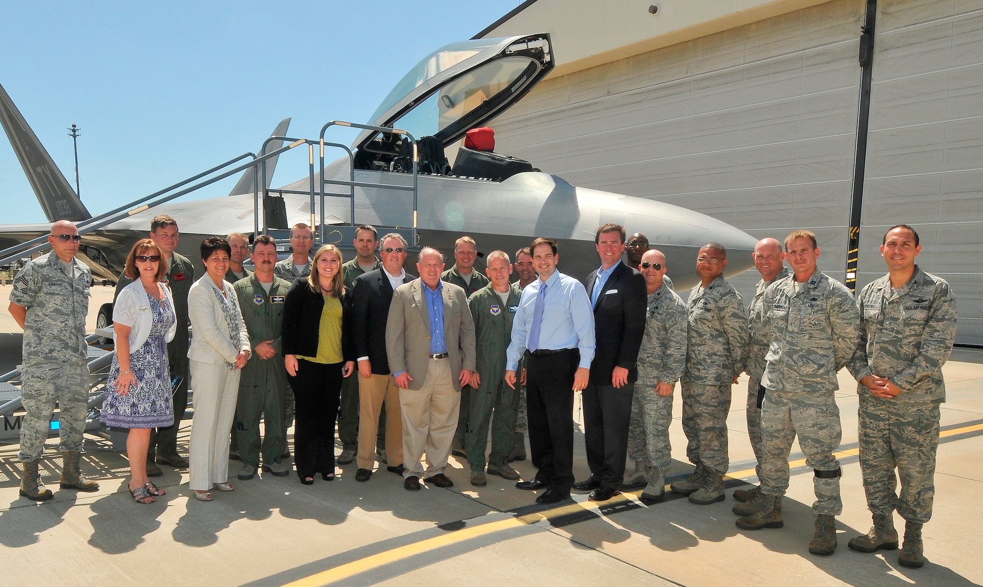 Florida Senator, Marco Rubio, Military Legislative Assistant Brian Walsh, State director Todd Reid, Region director Kris Tande, and Secretary of the Air Force Legislative Liaison, Lt. Col. Lori Largen, Brigadier General John McMullen, 325th Fighter Wing commander and other base leadership posed for a photo in front of an F-22 Raptor during the senator’s familiarization tour of the base. (U.S. Air Force photo by Christopher Cokeing)