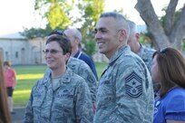 Brig. Gen. Theresa Carter, Joint Base San Antonio and 502nd Air Base Wing commander, and Chief Master Sgt. Jose LugoSantiago, JBSA and 502nd ABW command chief master sergeant, attend the JBSA-Fort Sam Houston Fiesta ceremony April 22 at MacArthur Field as part of the JBSA's participation in Fiesta festivities. (U.S. Air Force Photo by Joel Martinez)