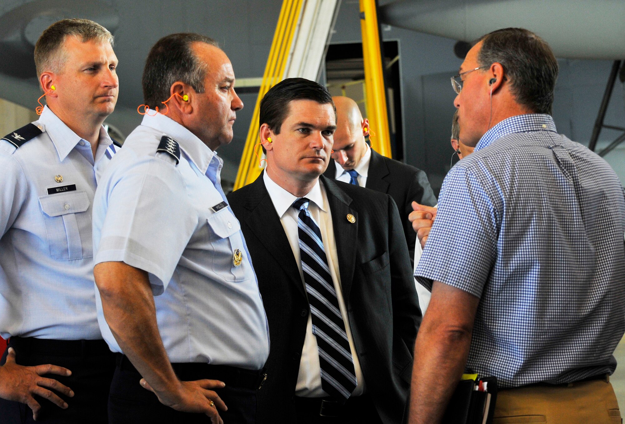 L-R, Col. Evan Miller, 402nd Maintenance Wing commander; Air Force Vice Chief of Staff Gen. Phil Breedlove; and U.S. Rep. Austin Scott, (R-Ga.) listen to a briefing by Richard Frey, 560th Aircraft Maintenance Squadron director, at the C-130 High Velocity Maintenance Hangar. The visit on Monday also included a tour of the E-8C Joint STARS area, the 689th Combat Communications Wing and Headquarters Air Force Reserve Command. ( U. S. Air Force photo by Sue Sapp)