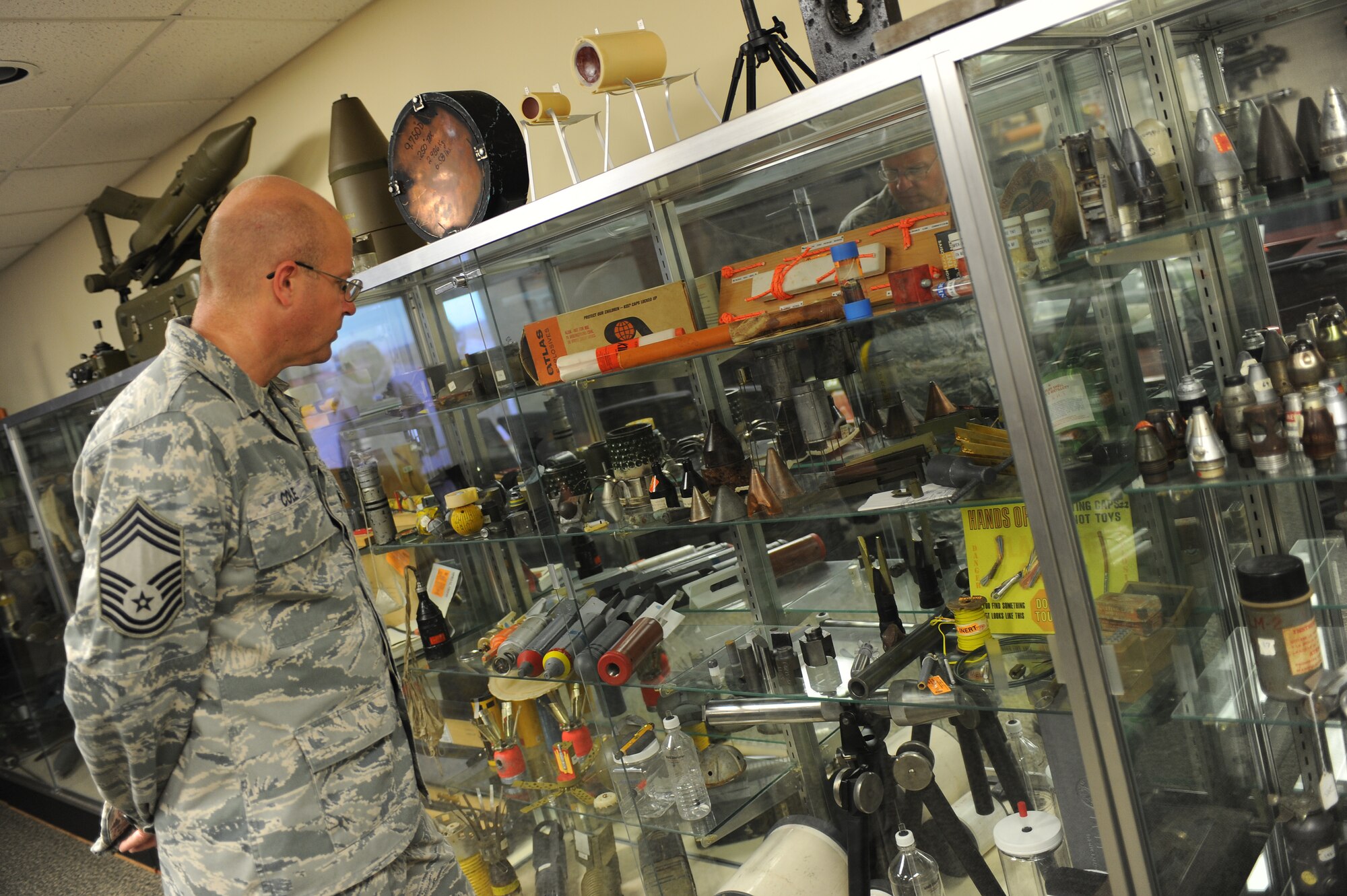 U.S. Air Force Chief Master Sgt. Todd Cole views displayed equipment gathered by explosive ordnance disposal personnel during the EOD open house on Seymour Johnson Air Force Base, N.C., May 1, 2012. The EOD open house spanned from 1 p.m. to 3 p.m. and gave visitors a glimpse into the EOD profession. Cole, 4th Operations Group superintendent, hails from Salt Lake City, Utah. (U.S. Air Force photo/Airman 1st Class John Nieves Camacho/Released)