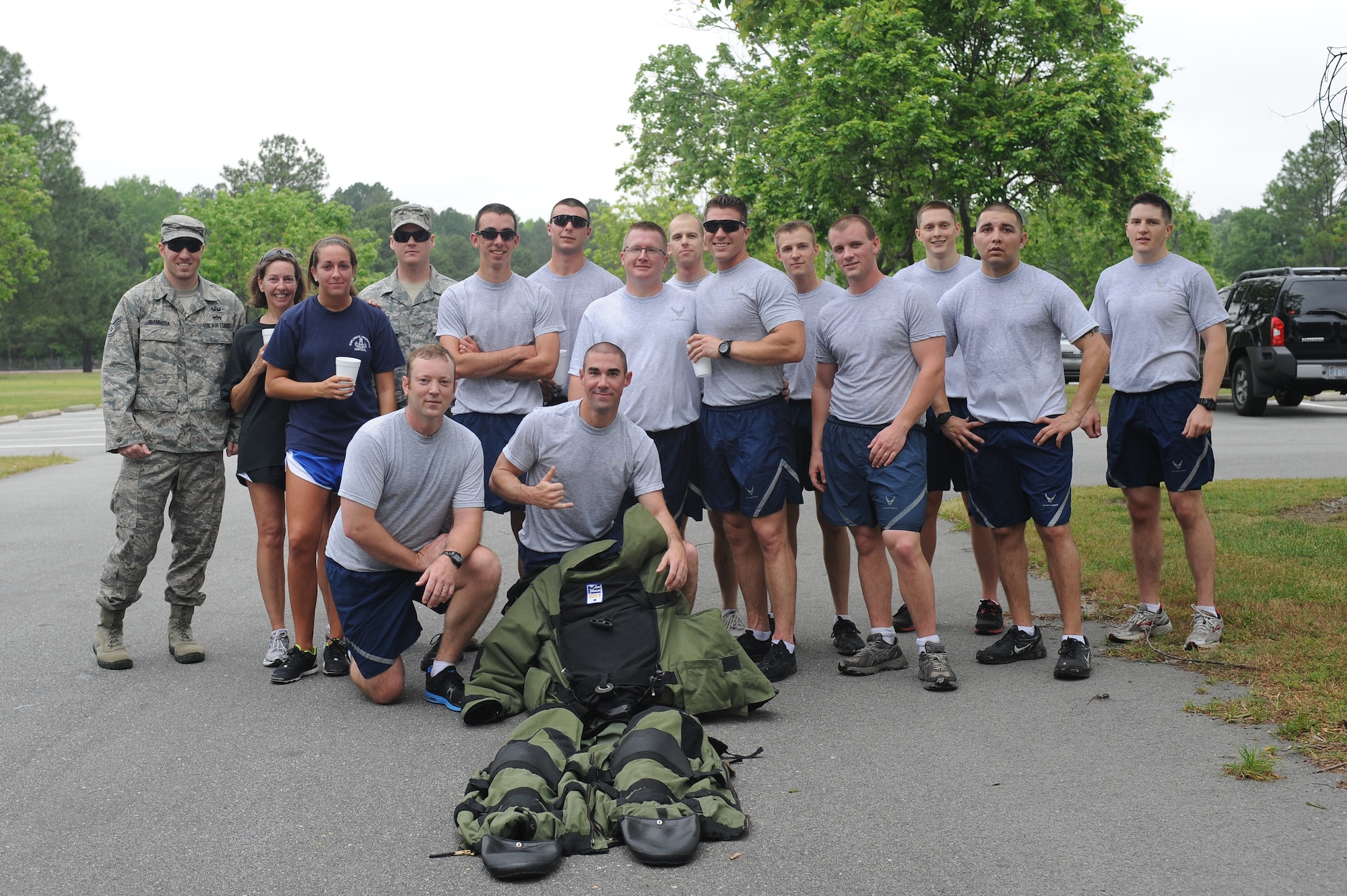Members of the explosive ordnance disposal flight pose with an EOD 9-bomb disposal suit after completing a six-mile memorial run on Seymour Johnson Air Force Base, N.C., May 1, 2012. The first Saturday of May is National EOD day, honoring past and present EOD professionals. (U.S. Air Force photo/Airman 1st Class John Nieves Camacho/Released)