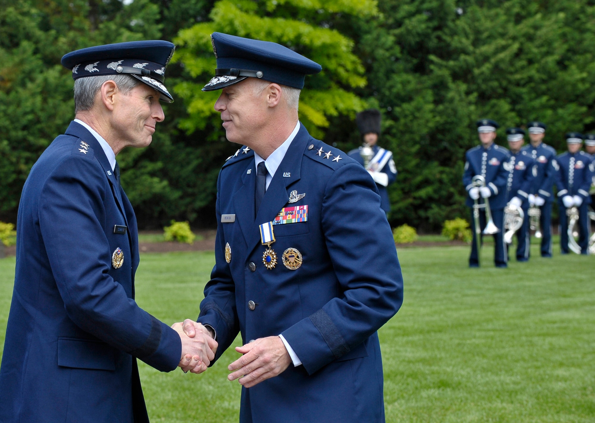 Air Force Chief of Staff Gen. Norton Schwartz congratulates Lt. Gen. Richard Y. Newton III, Assistant Vice Chief of Staff and Director, Air Staff, Headquarters U.S. Air Force, after retiring Newton at a ceremony on Joint Base Anacostia-Bolling, D.C., on April 27, 2012.  (U.S. Air  Force photo/Michael J. Pausic)