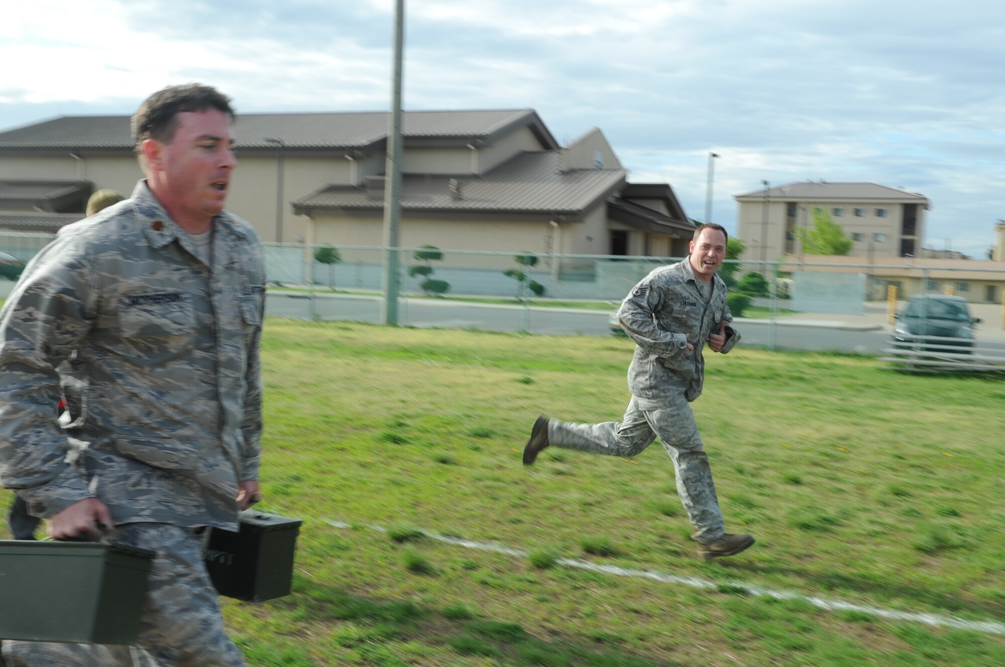 Staff Sgt. Brandon Coleman, right, 8th Maintenance Squadron, encourages teammate Maj. Ryan McPherson, 8th Operations Support Squadron, during a combat fitness test May 2, 2012, at Kunsan Air Base, Republic of Korea. Used by the Marines, the CFT is a realistic way to assess how prepared someone is to handle the physical rigors of deployment. (U.S. Air Force photo/Senior Airman Brigitte N. Brantley)