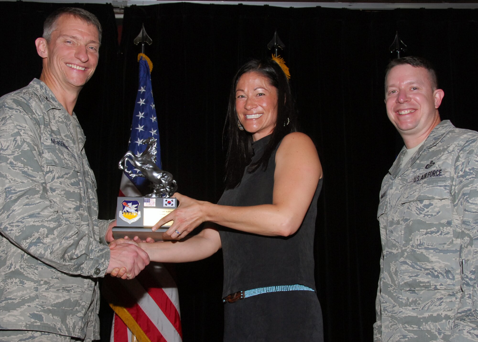 Ms. Pootthachart "Opp" Slawson, Volunteer of the Quarter, administrative service category. (U.S. Air Force photo/Mr. Song, Kyong Hwan)