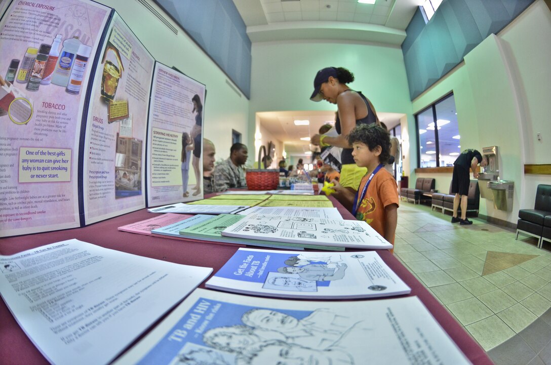 Airman and dependants attend the health and wellness fair held at the Coral Reef Fitness Center May 1. The Health and Wellness Center provided the fair for servicemembers and their dependants at the fitness center. The array of booths set up varied from the family advocacy program, education, healthy eating, immunizations and massage therapy. (U.S. Air Force photo by Staff Sgt. Alexandre Montes)
