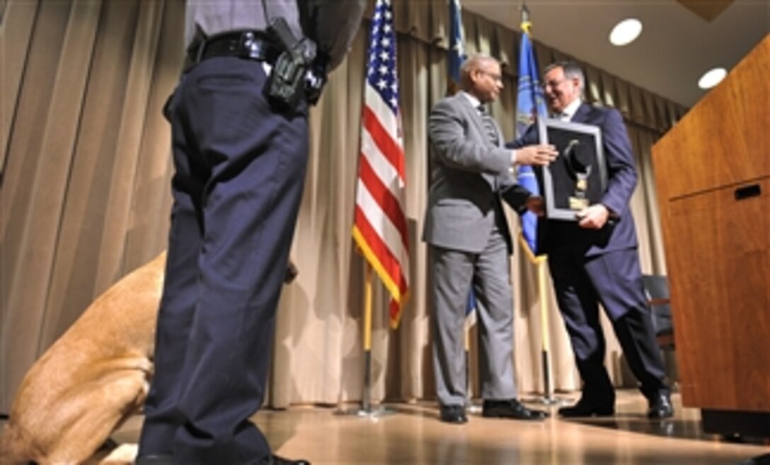 Secretary of Defense Leon E. Panetta is given the Bravo Award by Deputy Director of the Pentagon Force Protection Agency Jonathan Cofer during the Pentagon Force Protection Agency's 10-year anniversary celebration at the Pentagon on May 2, 2012.  PFPA was established as a Defense Agency on May 3, 2002, in response to the Sept. 11, 2001, terror attacks and the October 2001 anthrax attacks. 