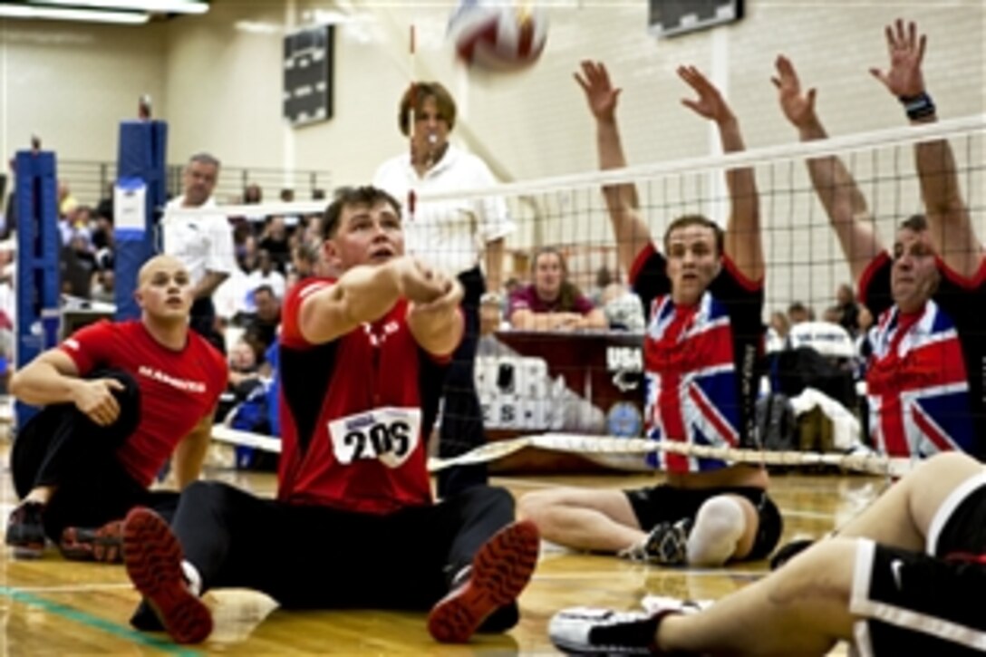 Marine Corps Sgt. Stephen K. Lunt bumps the ball to a teammate as the all-Marine team plays the United Kingdom team in a sitting volleyball match during the 2012 Warrior Games at the U.S. Air Force Academy in Colorado Springs, Colo., May 2, 2012. The undefeated Marines won the match in two games, continuing their 3-0 winning streak.