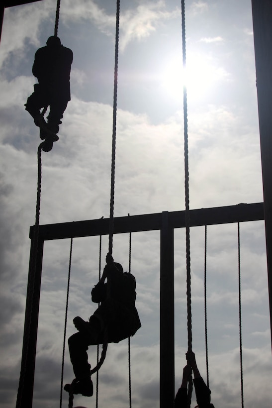 Company A recruits climb ropes at the end of the Obstacle Course May 3 aboard Marine Corps Recruit Depot San Diego. This is the last obstacle on the course that recruits have to overcome. This course requires recruits to use a lot of upper body strength, making it even more challenging to climb the rope at the end of the course.